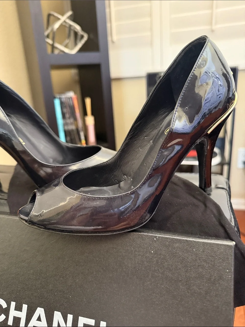CHANEL Black Patent Peep-Toe Stiletto Pumps with Gold CC Heel Accent